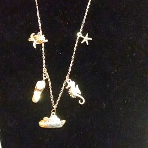 Cruise ship charm necklace. With turtle.seahorse. starfish flip flop and cruise.